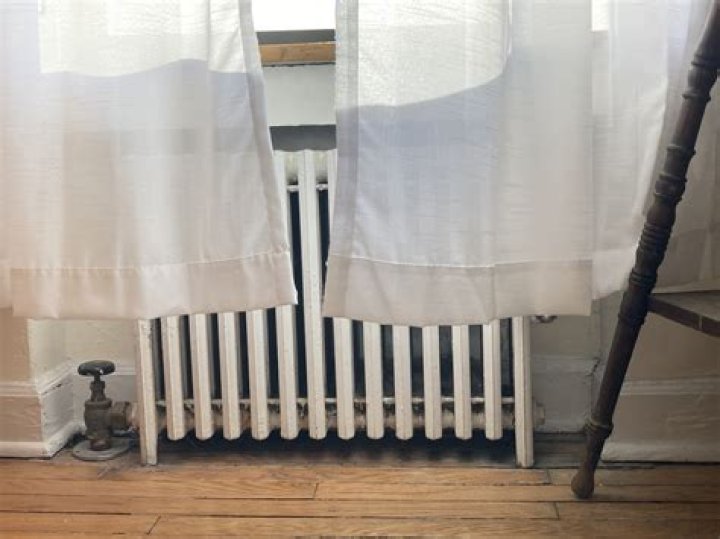 Can curtains touch radiator covers?