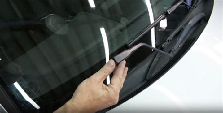 How do I get ice off my windshield fast?