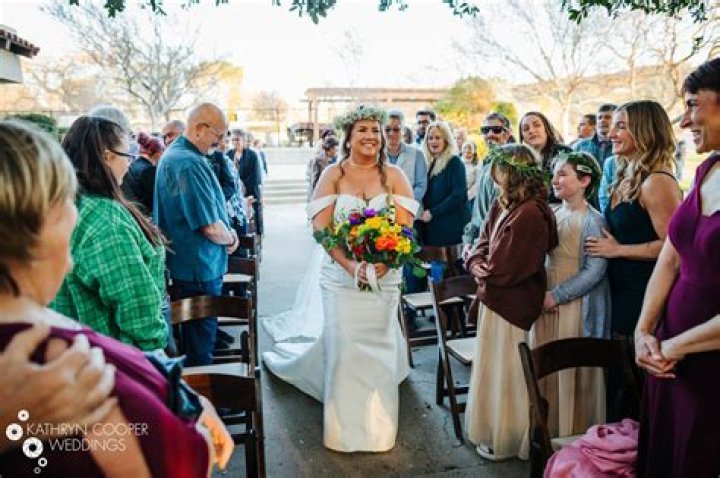How do two brides walk down the aisle?