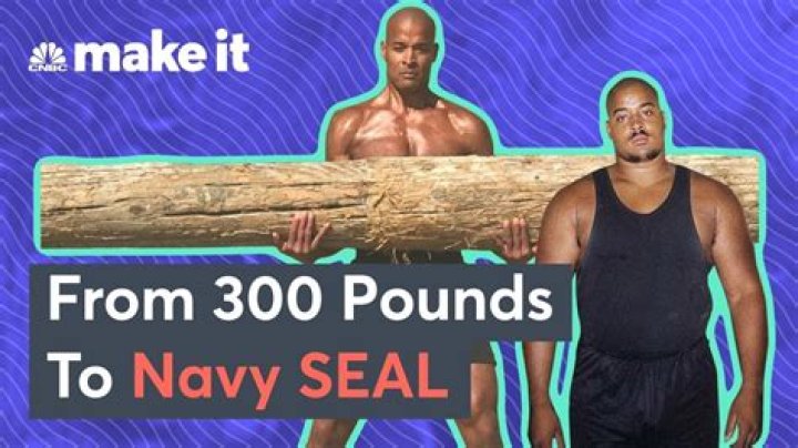 How much weight do Navy SEALs carry?
