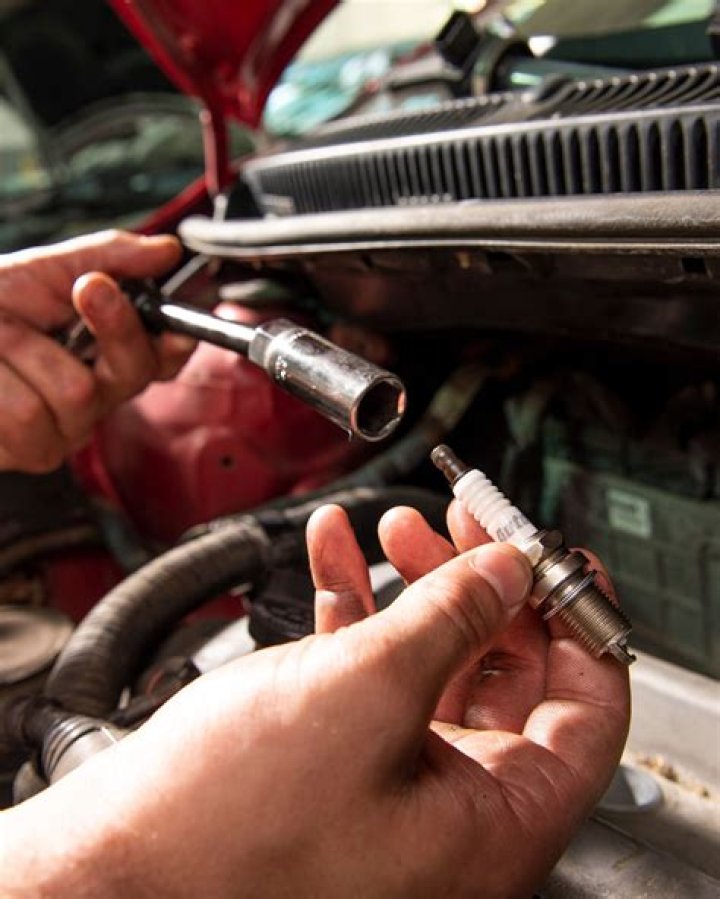 Should you let your engine cool before changing spark plugs?