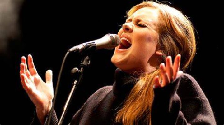 What is belting when singing?