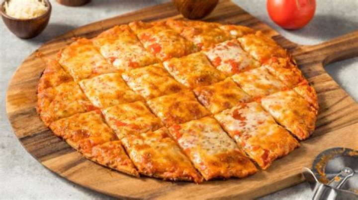 Where did tavern style pizza come from?