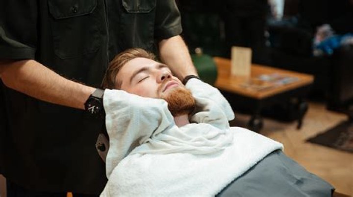 Why do barbers use hot towels?
